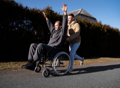 friend-helping-smiley-disabled-man-full-shot (1) (1)
