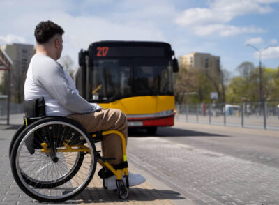 full-shot-disabled-man-waiting-bus (1)